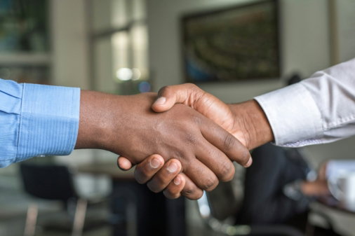 two people shaking hands